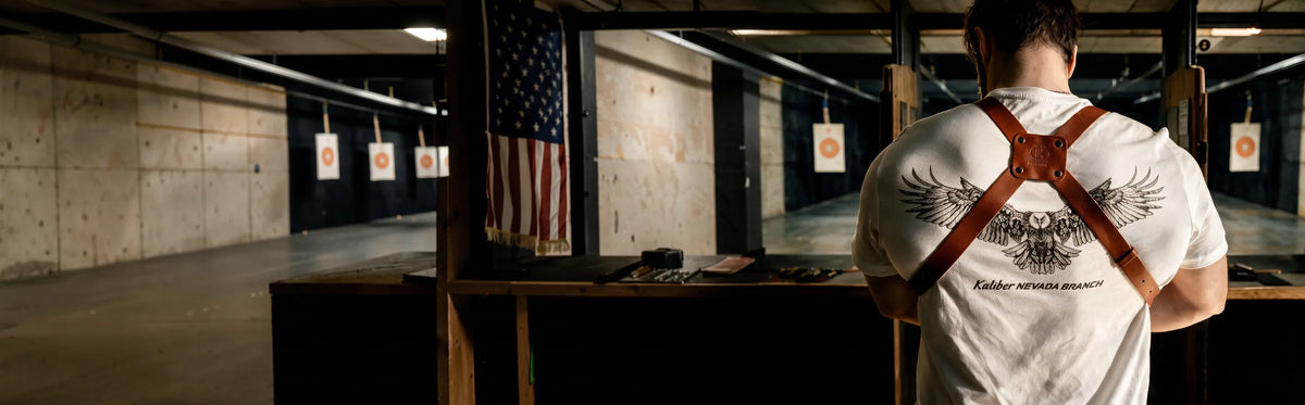 Man wearing a Kaliber leather shoulder holster at a shooting range